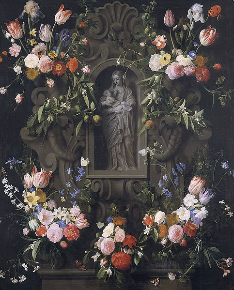 Garland of flowers with a sculpture of the Virgin Mary